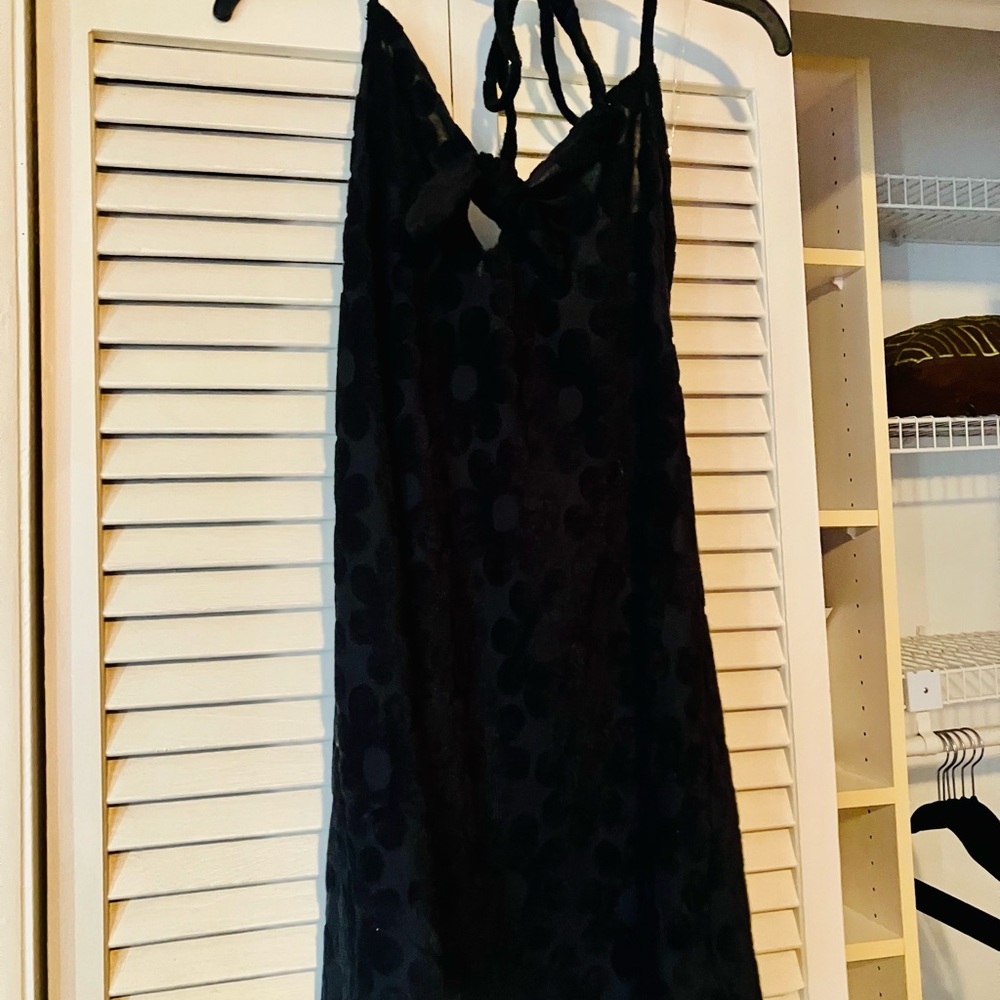 No Boundaries black mini dress with a tie-front and halter style design
